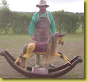 Chris Woolcock with the restored rocking horse